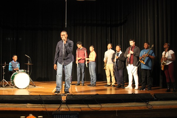 Musical group performing, "I feel good", sang by James Brown.